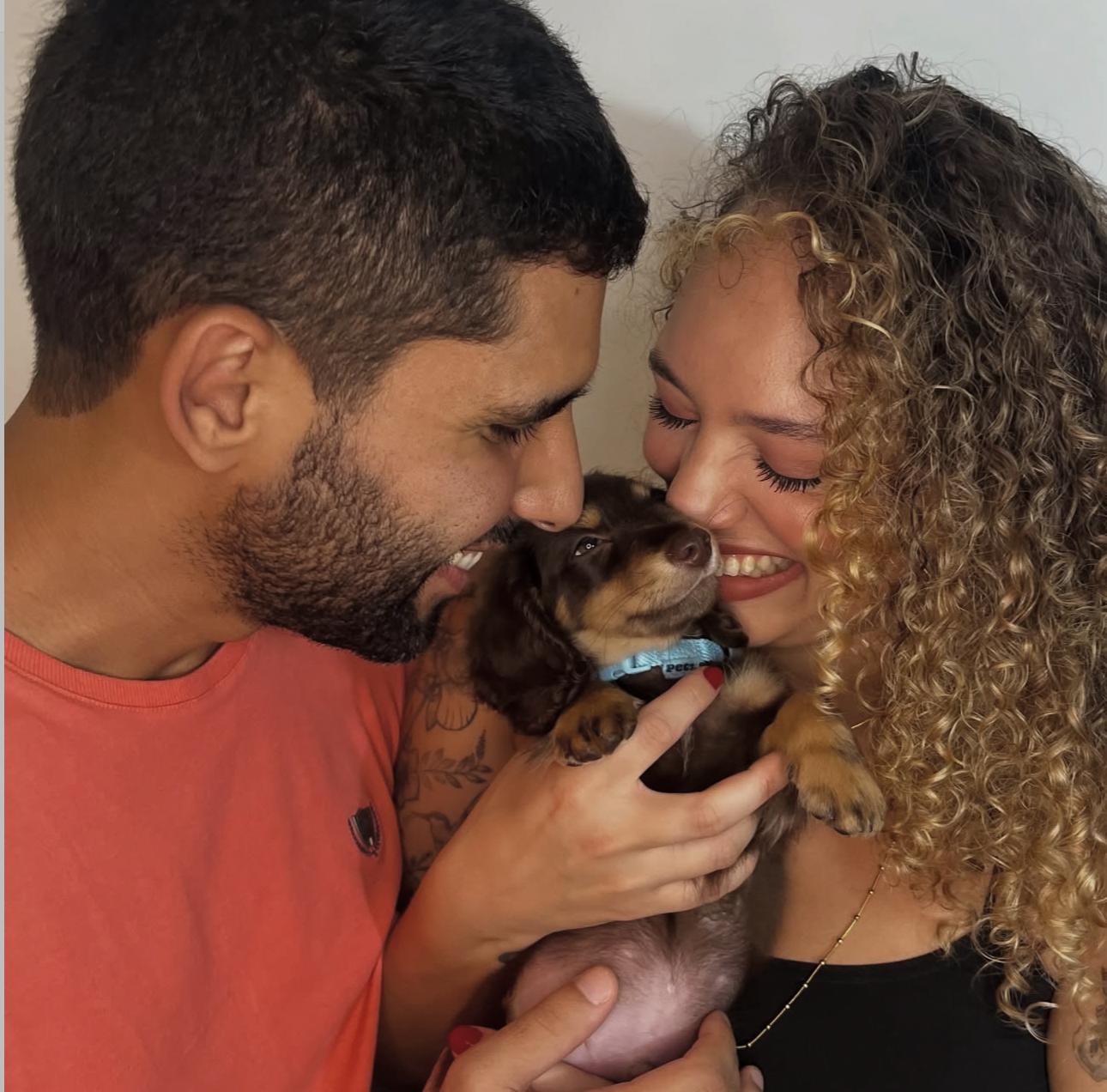 Happy family with their puppy