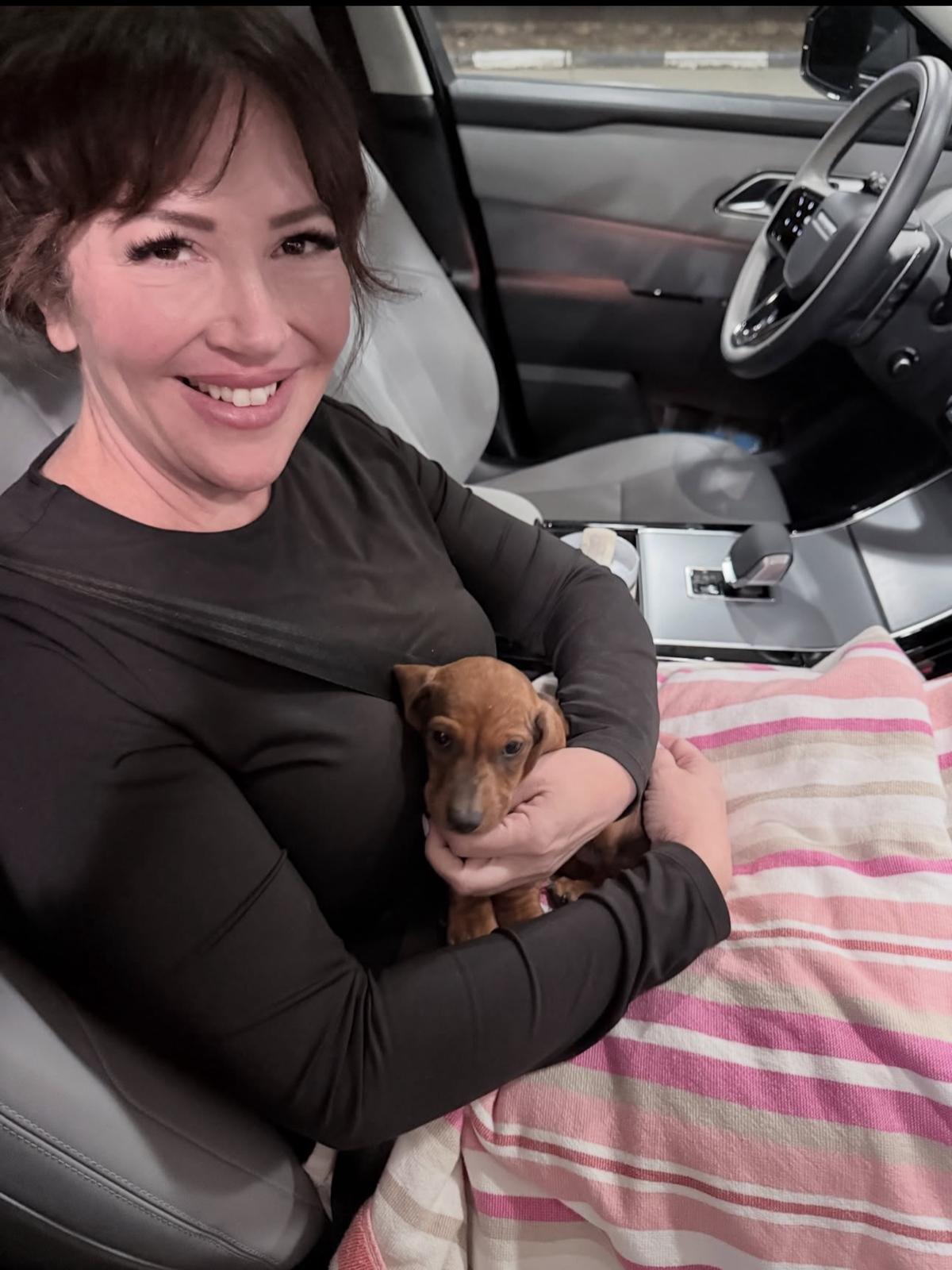 Happy family with their puppy