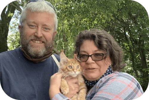 Happy family with their puppy