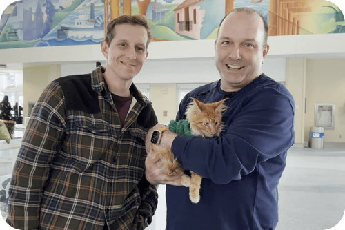 Happy family with their puppy